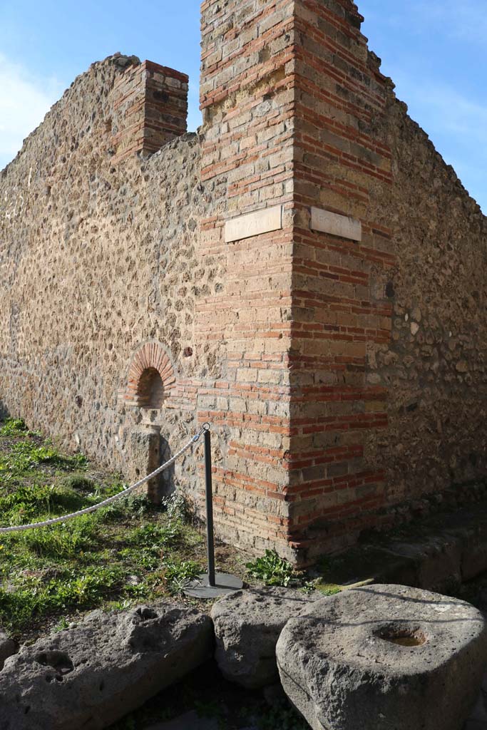 Vicolo di Tesmo, on right, Pompeii. December 2018. 
Looking north-west towards IX.4, and street shrine at junction. Photo courtesy of Aude Durand.