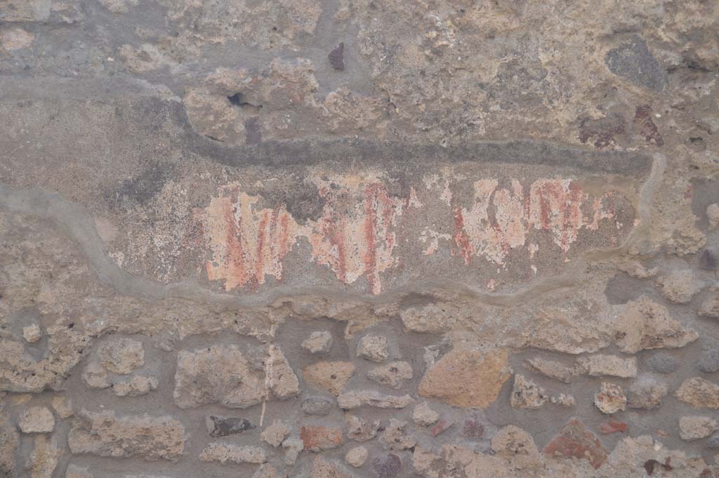 Vicolo di Tesmo, Pompeii. March 2019. Remaining graffiti on wall above seat outside IX.3.20. 
Foto Taylor Lauritsen, ERC Grant 681269 DÉCOR.