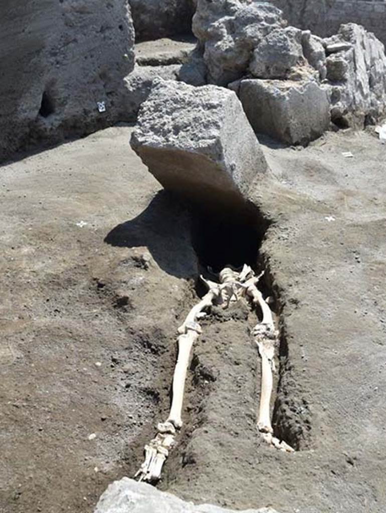 In 2018 at the intersection of the Vicolo delle Nozze d’Argento with the Vicolo c.d. dei Balconi the headless skeleton of a male victim was found. 
From the first observations, the individual who survived the early stages of the volcanic eruption, ventured in search of escape along the vicolo now filled by a thick blanket of lapilli. 
The body was in fact found at the height of the first floor of the adjacent building, above the lapilli layer. 
He was originally thought to have been killed by a large stone block, possibly a door jamb.
The skull of this man was found later at a lower level than the rest of his body, having been displaced by the collapse of a Bourbon tunnel below. 
The skull itself suggests that he was not, as first thought, crushed to death by the block but rather asphyxiated during the pyroclastic flow that threw him backwards.
He had with him at least 20 silver and 2 bronze coins, contained in a small purse. 
Between the ribs were found the first three coins, and gradually, on removing the remains of the victim, now transferred to the Laboratory of applied research of the archaeological Park of Pompeii, for the continuation of investigations, the remainder were found.
At first glance there would seem to be at least 20 silver denarii and two bronze asses with a nominal value of eighty sesterces and a half. 
Such a quantity of coins could at that time guarantee the maintenance of a family of three for 14 to 16 days.
The coins have a very varied chronology. It was possible to examine 15 coins, for the most Republican, starting from mid-2nd century BC.
One of the later Republican coins, is a Legionary Denarius of Mark Antony, common in Pompeii, with the indication of the XXI legion. 
Among the few identified imperial coins, a probable denarius of Octavian Augustus and two denarii of Vespasian.
Photograph © Parco Archeologico di Pompei.