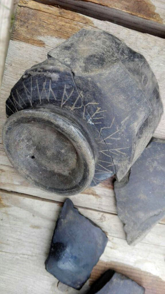 Santuario extraurbano del Fondo Iozzino.  2014. Pottery with scratched Etruscan inscription.
Photograph © Parco Archeologico di Pompei. 
In the suburb of Pompeii, in the heart of the modern city, archaeological investigations have resumed in the Sanctuary of the Fondo Iozzino. The area, once a quarry for extraction of lapilli owned by Iozzino, investigated several times since 1960, has seen since 2014 the start of a thorough and continuous research that has led to the discovery of a rich mass of votive offerings, with epigraphic testimonies in the Etruscan language that have cast new light on the archaic Pompeii, returning what is currently the richest repertoire of Etruscan inscriptions in Campania.
Nel suburbio di Pompei, nel pieno centro della città moderna, sono riprese le indagini archeologiche nel Santuario del Fondo Iozzino. L’area, un tempo cava di estrazione del lapillo di proprietà Iozzino, indagata a più riprese a partire dal 1960, ha visto dal 2014 l’avvio di una ricerca approfondita e continuativa che ha portato alla scoperta di una ricca messe di offerte votive, con testimonianze epigrafiche in lingua etrusca che hanno gettato nuova luce sulla Pompei arcaica, restituendo quello che al momento è il più ricco repertorio di iscrizioni etrusche della Campania.
Vedi http://pompeiisites.org/press-kit/nuovi-scavi-e-ricerche-nel-parco-archeologico-di-pompei/
