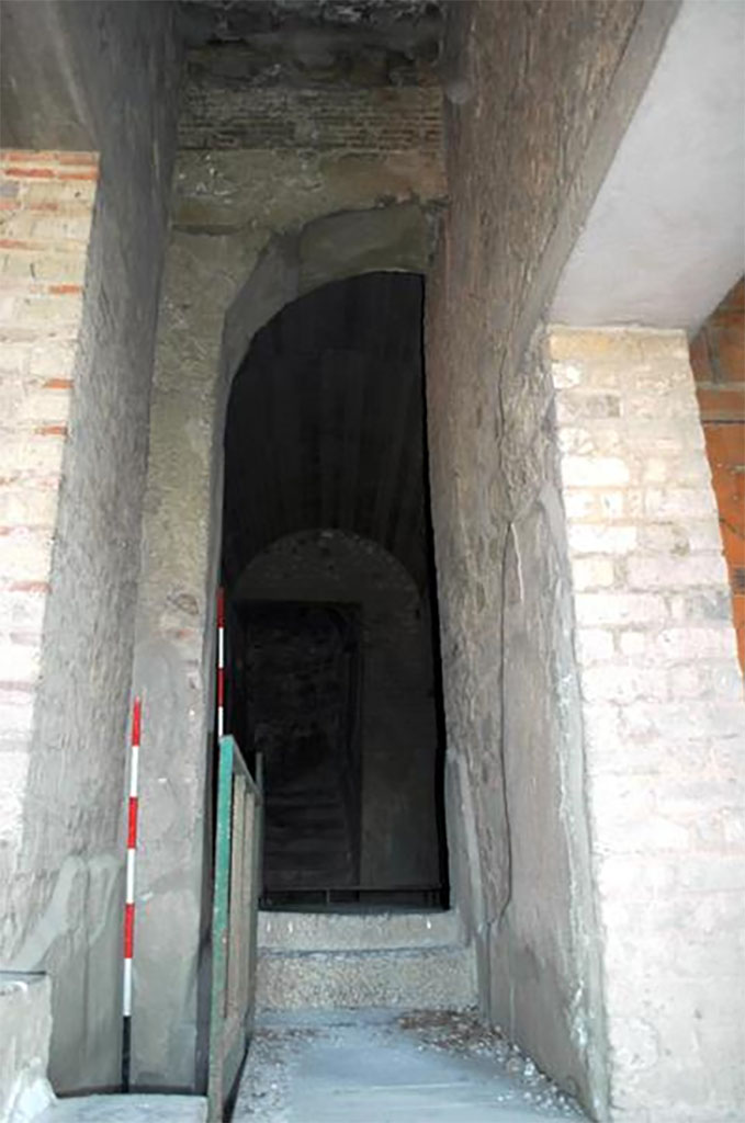 VII.16.17-22 Pompeii. 2014. Corridor 43 with steps ahead with doorway to yellow room right and black room left.
This is the location of the Porta Occidentalis or Western Gate, originally with houses at each side but the house was built over it in Roman times.
Researchers at The University of Suor Orsola Benincasa discovered the presence of the Porta Occidentalis (posterula) with access to the city, aligned on an axis with via di Nola and Porta di Nola inside a contemporarily chronological arch ascribable to between III and II century BC. 
VII.16.17-22 Pompei. 2014. Corridoio 43 con gradini avanti con porta alla camera gialla a destra e stanza nera a sinistra.
Questa è la posizione della Porta Occidentalis o Porta Occidentale, originariamente con case su ogni lato, ma la casa è stata costruita su di esso in epoca romana.
I ricercatori dell'Università di Suor Orsola Benincasa hanno scoperto la presenza della Porta Occidentalis (posterula) con accesso alla città, allineata su un asse con via di Nola e Porta di Nola all’interno di un arco cronologico coevo ascrivibile tra III e II secolo a.C.
Photograph © Parco Archeologico di Pompei.
https://www.identitainsorgenti.com/verso-il-4-maggio-due-nuove-scoperte-nel-sito-la-porta-occidentalis-e-il-santuario-fuori-le-mura/