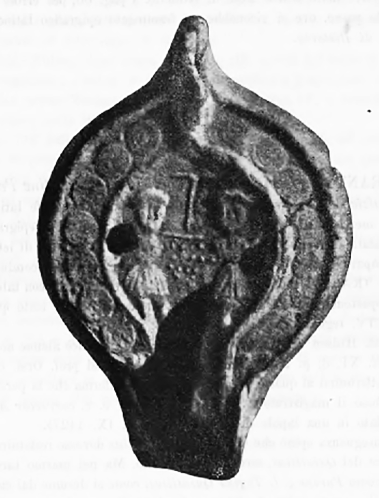 Boscoreale, Tombe Cristiane in contrada Pisanella. 
Lamp with relief of two persons found in tomb.
See Notizie degli Scavi di Antichità, 1897, p. 109.