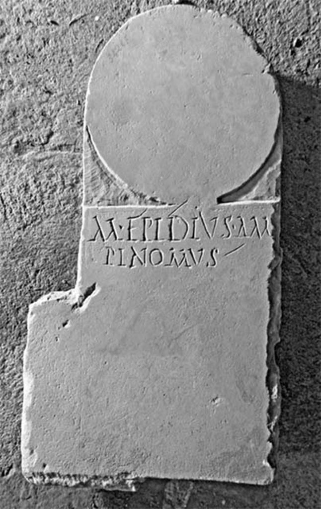 Pompeii Fondo Azzolini. Tomb 5: Marcus Epidius Ampinomus.
Columella with inscription
M EPIDIUS AM
PINOMUS
M(arcus) Epidius Ampinomus
See Notizie degli Scavi di Antichità, 1916, 303, t5.
Photo © Umberto Soldovieri.
