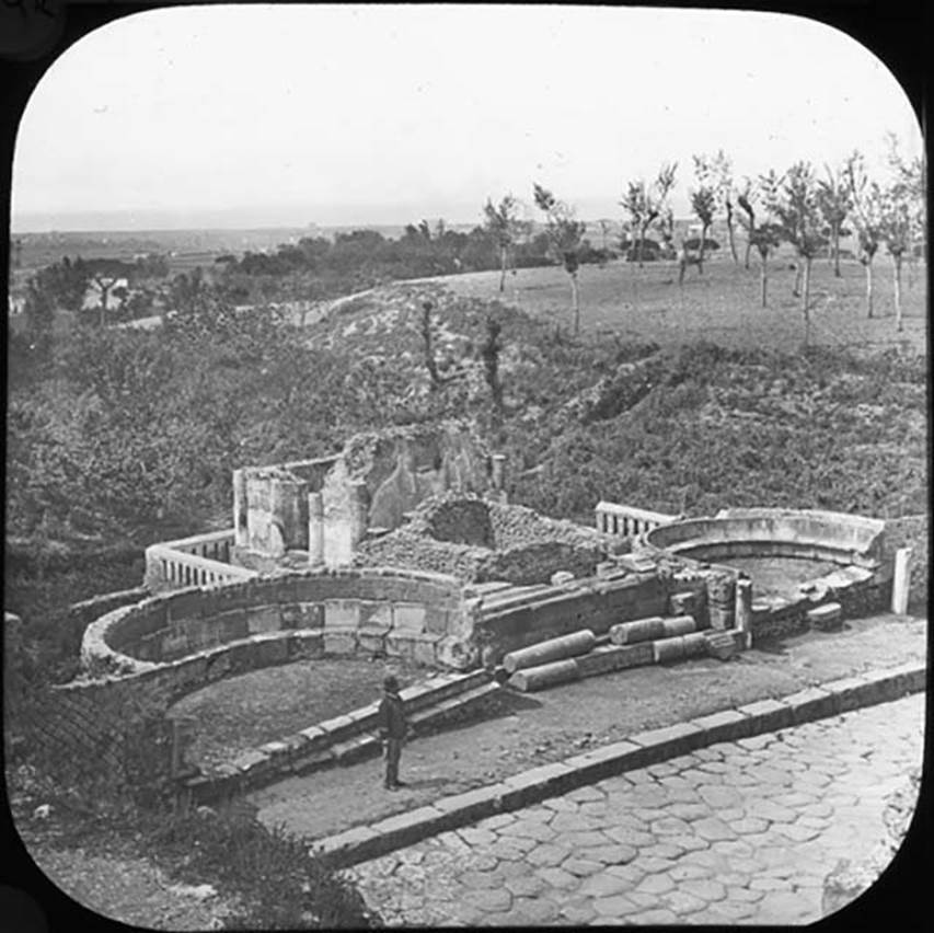 HGW02-4 Pompeii, with HGW03, in centre behind the fallen columns. Looking north-west. Photo by permission of the Institute of Archaeology, University of Oxford. File name instarchbx208im 031. Source ID. 44357.