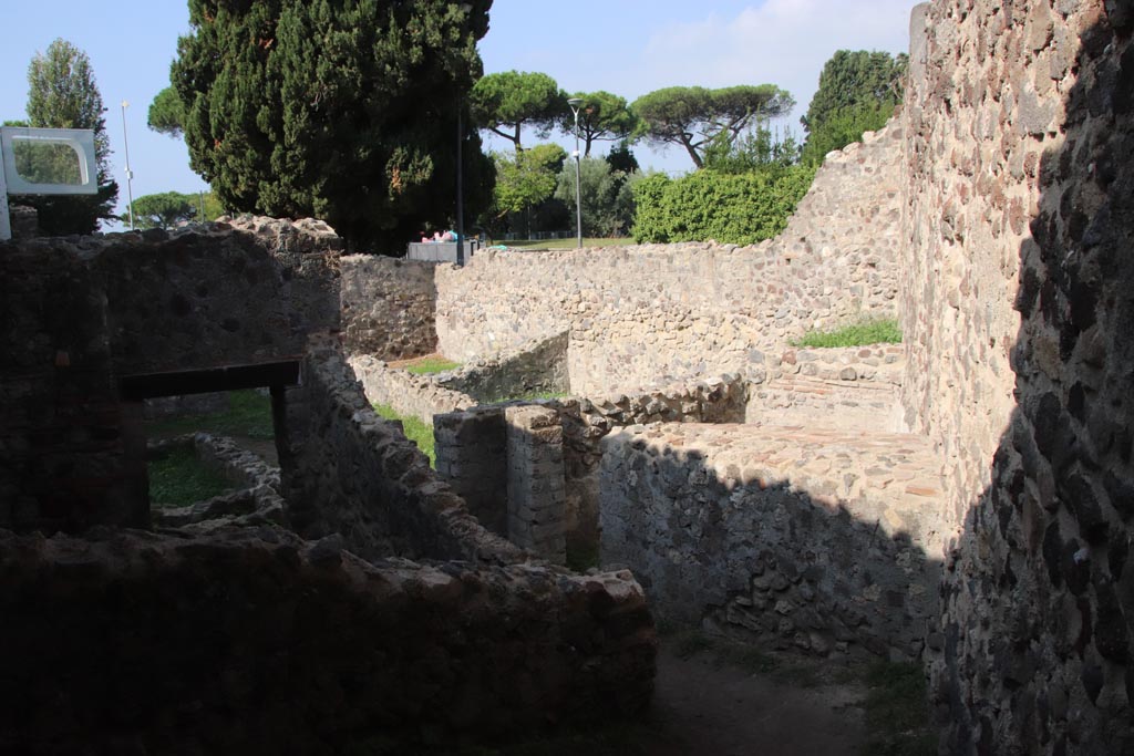HGW25 Pompeii. Part of Villa of Diomedes. October 2023. 
Looking north-west from room 7,3, towards corridor 7.4, and room on right, 7,5. (Fontaine’s numbers on plan.) Photo courtesy of Klaus Heese.