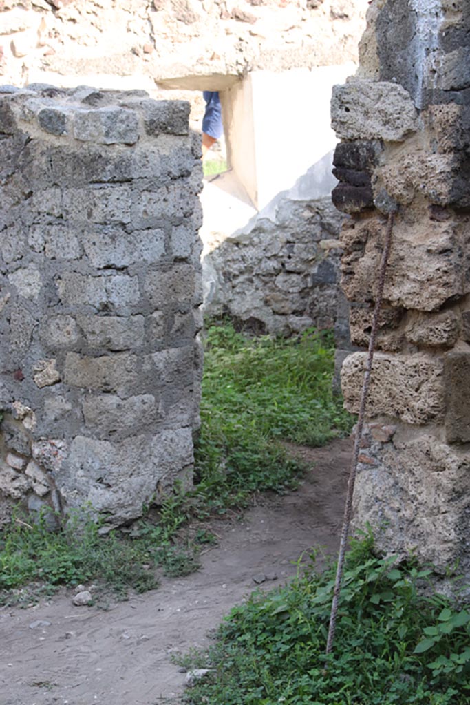 HGW25 Pompeii. Part of Villa of Diomedes. October 2023.
Looking east through doorway in room 7,5 with window in east wall. Photo courtesy of Klaus Heese.