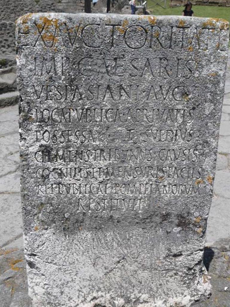 Pompeii Porta Nocera. May 2012. South side of Cippus of Titus Suedius Clemens.
Photo courtesy of Buzz Ferebee. The Cippus has the Latin inscription:
Ex auctoritate 
imp(eratoris) Caesaris 
Vespasiani Aug(usti)
loca publica, a privatis
possessa T(itus) Suedius 
Clemens tribunus causis 
cognitis et mensuris factis 
rei publicae Pompeianorum 
restituit,  
By virtue of authority conferred upon him by the Emperor Vespasian Caesar Augustus, 
Titus Suedius Clemens, tribune, having investigated the facts and taken measurements,
restored to the citizens of Pompeii public places illegally appropriated by private persons.
Similar Cippi were found at the Porta Ercolano, Porta Marina and the Porta Vesuvio.
The wording “rei publicae Pompeianorum” on one of these, discovered in 1763, was the first positive identification that the site was Pompeii. 
Until then scholars had divided opinions on the city buried under Cività.  
Many, including the first official excavators, thought it was the ancient city of Stabiae.
See Conticello, B., Ed, 1990. Rediscovering Pompeii. Rome: L’Erma di Bretschneider. (p. 225).