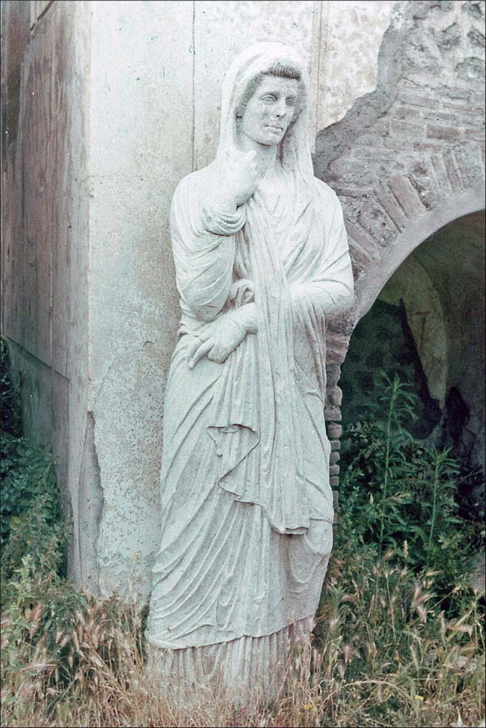 Pompeii Porta Nocera. June 1962. 
Tomb 6EN, marble female funerary statue found outside tomb of an anonymous female.
Photo by Brian Philp: Pictorial Colour Slides, forwarded by Peter Woods
(PCS POMPEII Statue of Woman Necropolis)