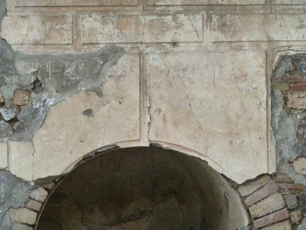 Pompeii Porta Nocera. May 2010. Tomb 12EN, plaster above niche on south side.
