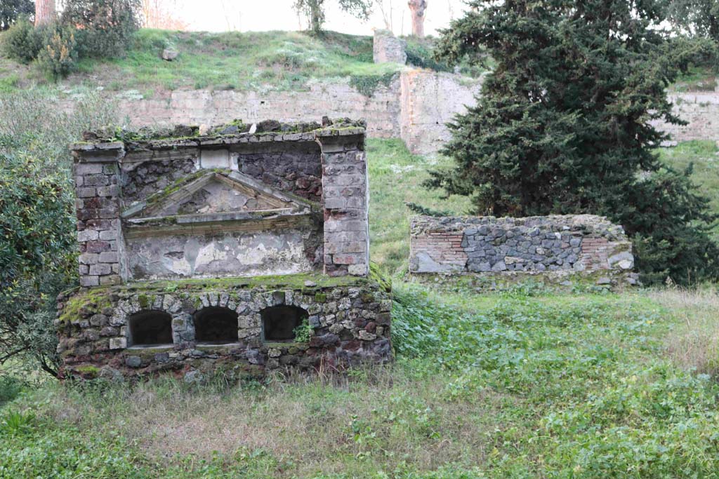 Pompeii Porta Nocera. December 2018. 
Looking north from Via delle Tombe, towards tomb 30EN, on left and 32EN, on right. Photo courtesy of Aude Durand.
