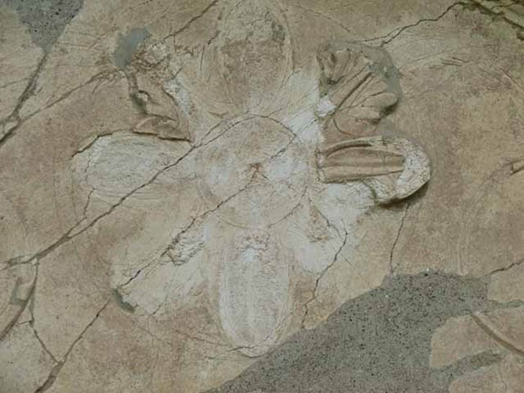 Pompeii Porta Nocera. Tomb 34aEN. May 2010. Detail of floral motif in stucco on west side of aedicula.