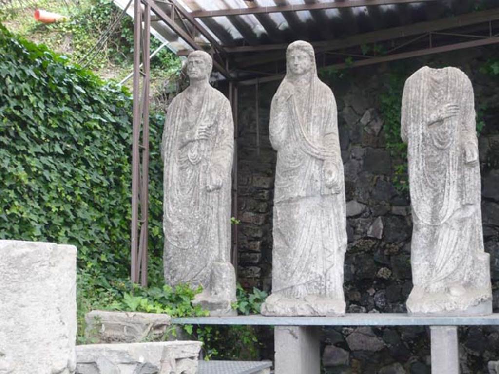 Pompeii Porta Nocera. Tomb 34aEN. May 2011. 
Three statues from tomb 34aEN now in display area between tombs OS and ES. 
Photo courtesy of Buzz Ferebee.