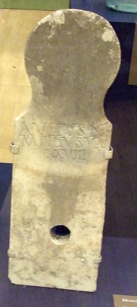 Pompeii Porta Nocera. September 2009. Tomb 11ES. Marble Columella with inscription:
A(ulus) VEIVS NYMPHIVS V(ixit) A(nnis) XXVIII.  
Found in south west corner of tomb. SAP 59764. 
Photographed at “A Day in Pompeii” exhibition at Melbourne Museum.  
See D’Ambrosio, A. and De Caro, S., 1983. Un Impegno per Pompei: Fotopiano e documentazione della Necropoli di Porta Nocera. Milano: Touring Club Italiano. (11ES).