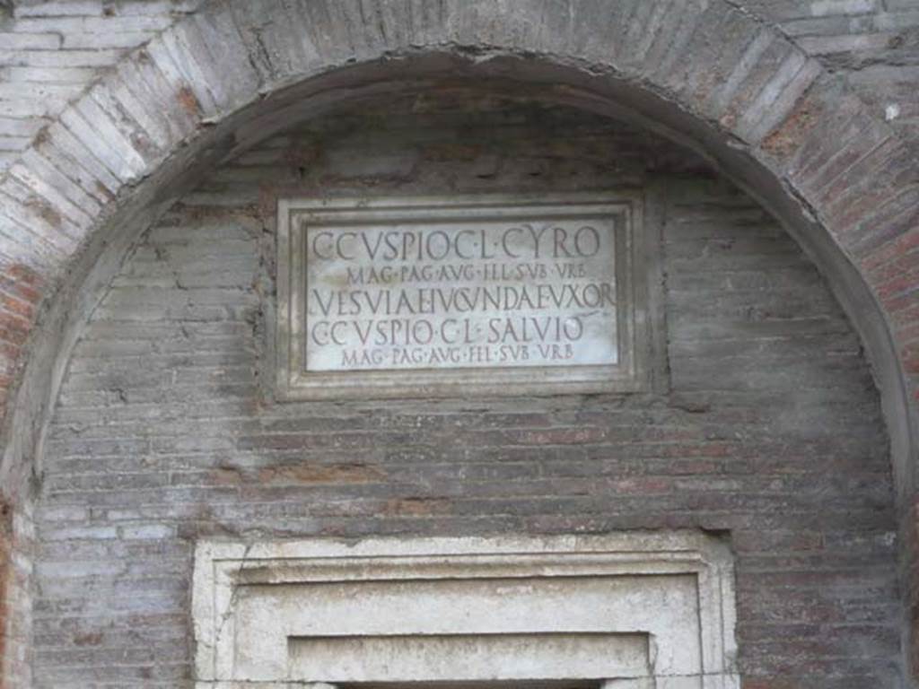 Pompeii Porta Nocera. Tomb 17ES. May 2011. Tomb arch with marble plaque with inscription above marble door.
Photo courtesy of Buzz Ferebee.