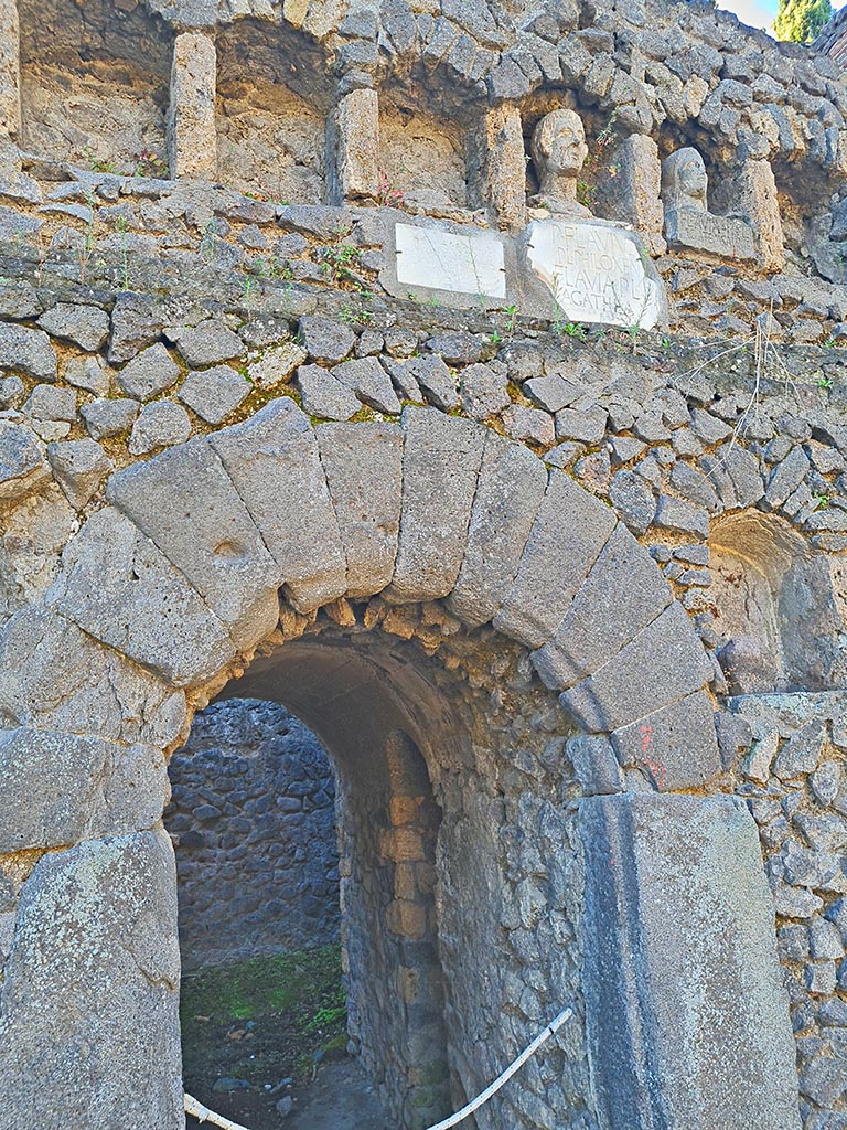 Pompeii Porta Nocera. October 2024. 
Tomb 7OS. Looking south towards central doorway, and busts and plaques with inscriptions. 
Photo courtesy of Giuseppe Ciaramella.