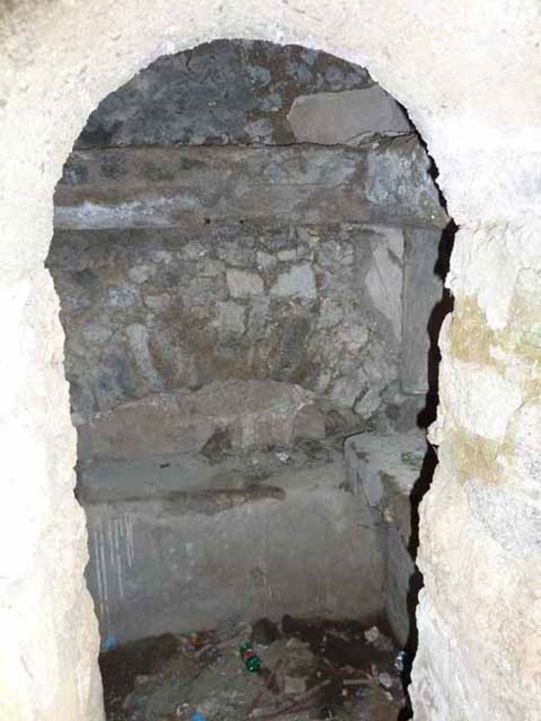 Pompeii Porta Nocera. May 2010. Tomb 7OS. Entrance to second identical room on west side of entrance corridor.
In the tomb arch on the north wall was found a broken cinerary urn.
In the tomb arch on the west side were three cinerary urns.
See D’Ambrosio, A. and De Caro, S., 1983. Un Impegno per Pompei: Fotopiano e documentazione della Necropoli di Porta Nocera. Milano: Touring Club Italiano. (7OS)