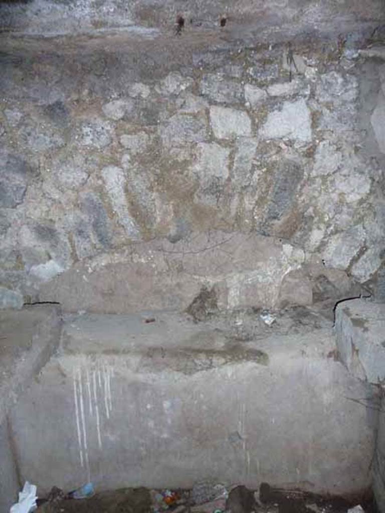 Pompeii Porta Nocera. May 2010. Tomb 7OS. Room on west side of entrance corridor. Niche on west wall. 
In the tomb arch on the west side were three cinerary urns.
The central one was inscribed in carbon, in Greek, AGATHEA FLAVIA.
On the urn on the left was written in Latin ACASTUS.
On the urn on the left was a inscription that had vanished apart from an A.
See D’Ambrosio, A. and De Caro, S., 1983. Un Impegno per Pompei: Fotopiano e documentazione della Necropoli di Porta Nocera. Milano: Touring Club Italiano. (7OS)