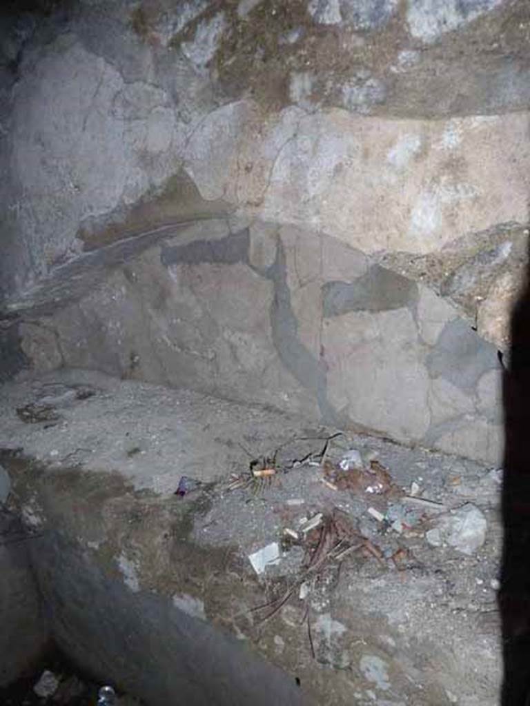 Pompeii Porta Nocera. May 2010. Tomb 7OS. Room on west side of entrance corridor. Niche on north wall. 
In the room on the west side in the tomb arch on the north wall was found a broken cinerary urn inscribed in charcoal FLAVIO / PHILOXENI (sic!).
See D’Ambrosio, A. and De Caro, S., 1983. Un Impegno per Pompei: Fotopiano e documentazione della Necropoli di Porta Nocera. Milano: Touring Club Italiano. (7OS)