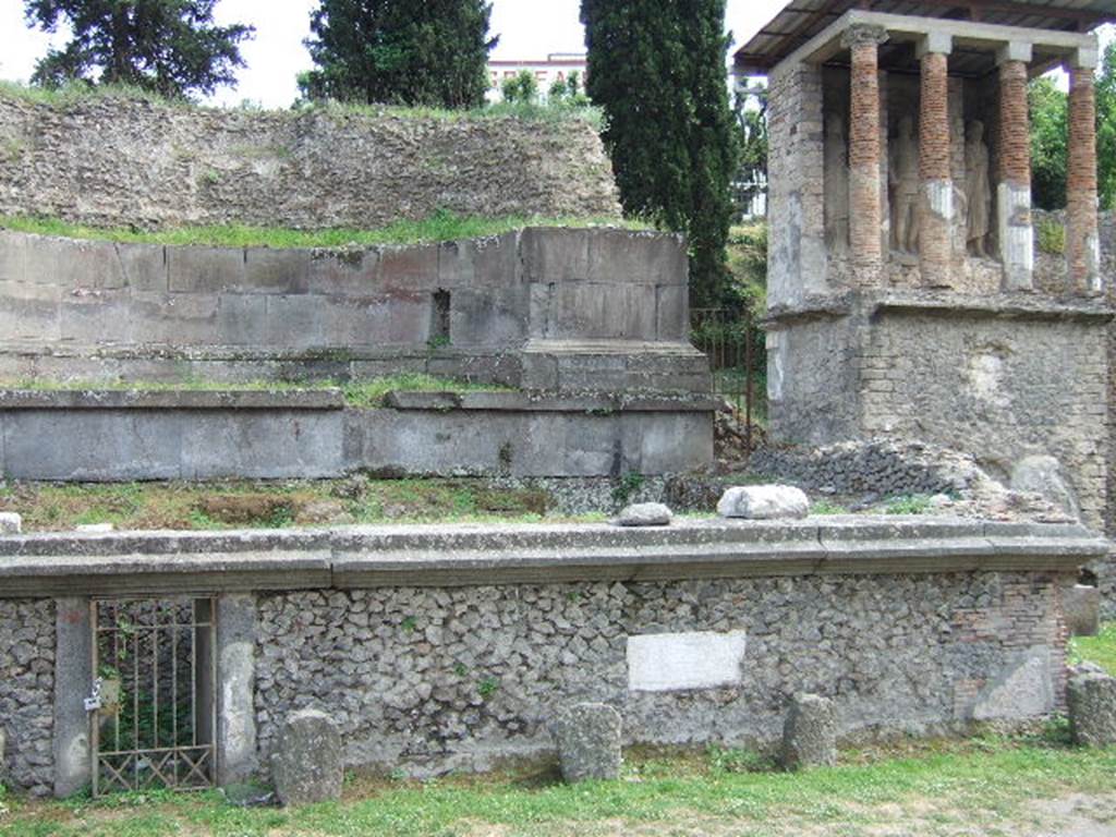 Pompeii Porta Nocera. May 2006. Tomb 11OS Tomb of Eumachia and Tomb 13OS, on right. 
The plaque on the front wall to the west contains the inscription SIBI ET SVIS.
A second plaque on the front wall to the east contains the inscription EUMACHIA L F.