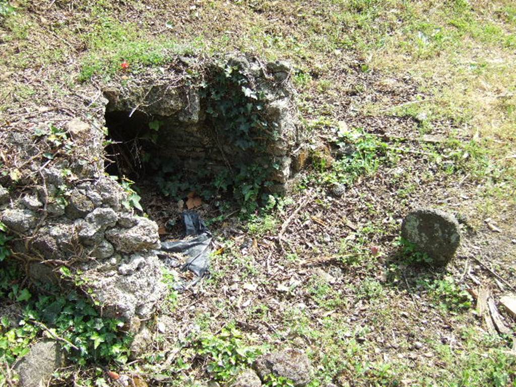 Pompeii Porta Nocera Tomb 17bOS. May 2006.
According to D’Ambrosio, in front of the tomb, facing east, four columellae were found.
From south to north these were
A female columella of lava.
A small marble columella
A lava columella, no longer in situ.
A columella carved from a marble slab, but with its head missing.
All were without inscriptions.
See D’Ambrosio, A. and De Caro, S., 1983. Un Impegno per Pompei: Fotopiano e documentazione della Necropoli di Porta Nocera. Milano: Touring Club Italiano. 17a b OS.