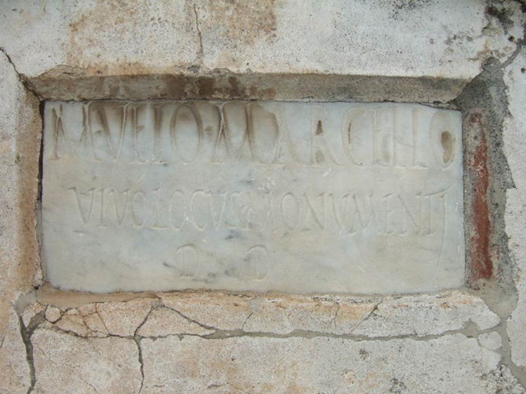 Pompeii VGI. December 2007. Marble plaque with Latin inscription. It reads -
M(arco) VEIO MARCELLO
VIVO LOCVS MONVMENTI
D(ecreto) D(ecurionum).
The tomb was still incomplete at the time of the eruption in 79 AD.
See La Rocca, de Vos, de Vos, 1981. Guida Archeologica di Pompei; II Edizione. Milano: Arnoldo Mondadori Editore.  (p. 280).