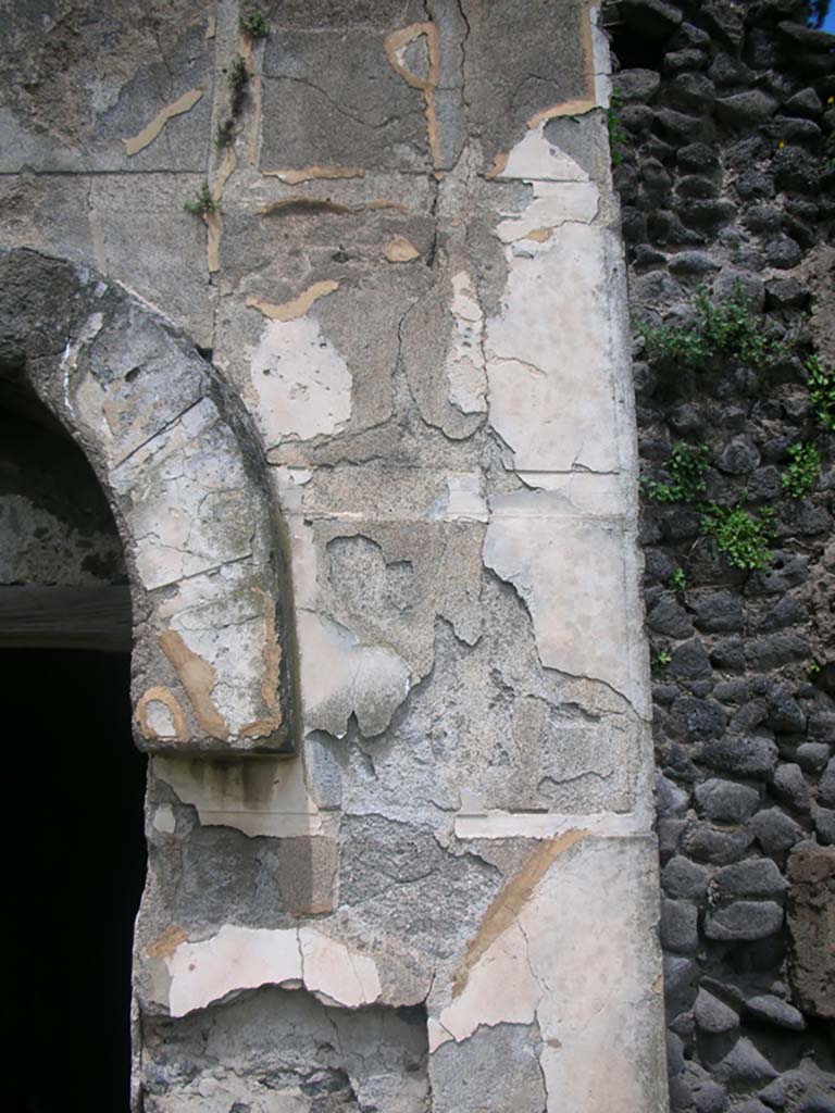 Tower X, Pompeii. May 2010. 
Detail of painted plaster on east side of doorway. Photo courtesy of Ivo van der Graaff.
