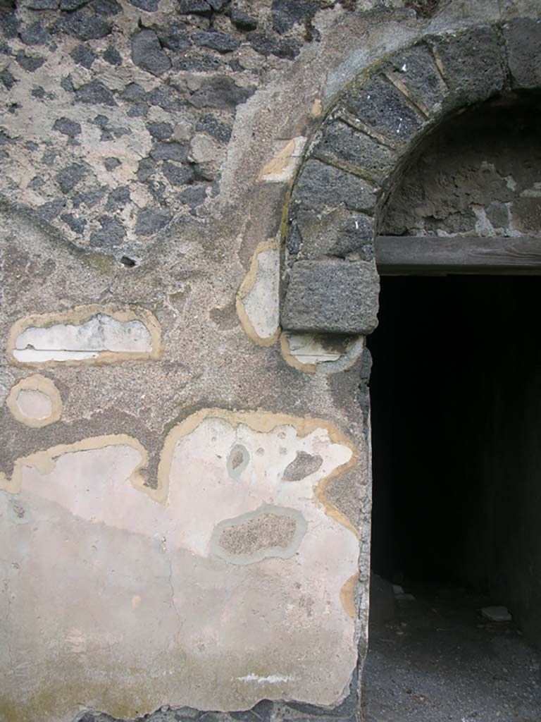 Tower X, Pompeii. May 2010. 
Detail of painted plaster on west side of doorway. Photo courtesy of Ivo van der Graaff.