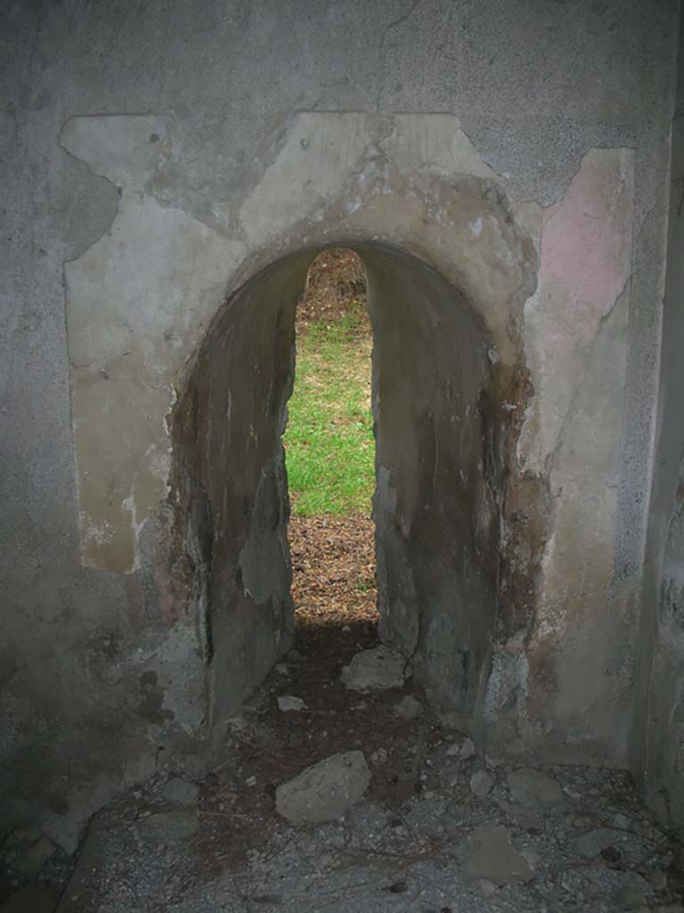 Tower X, Pompeii. May 2010. 
Looking north through arrow slit/window in north-west corner. Photo courtesy of Ivo van der Graaff.