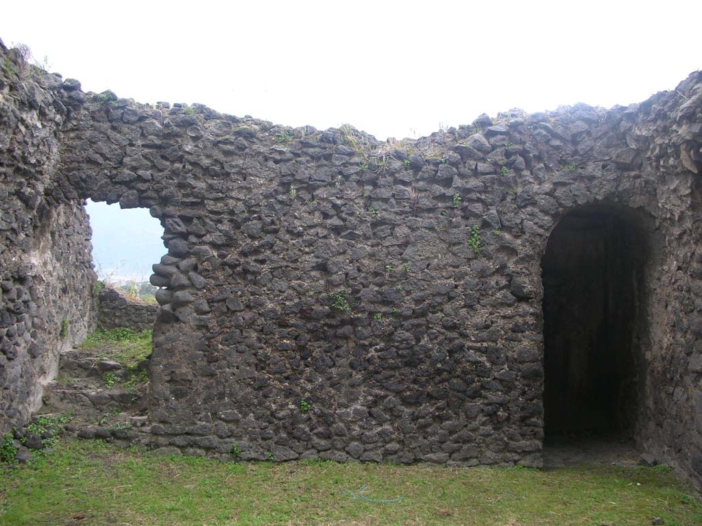 Tower X, Pompeii. May 2010. Looking towards south wall on first floor. 
The steps, on the left, would have led to the upper floor. The doorway, on the right, leads to steps to the lower floor.
Photo courtesy of Ivo van der Graaff.