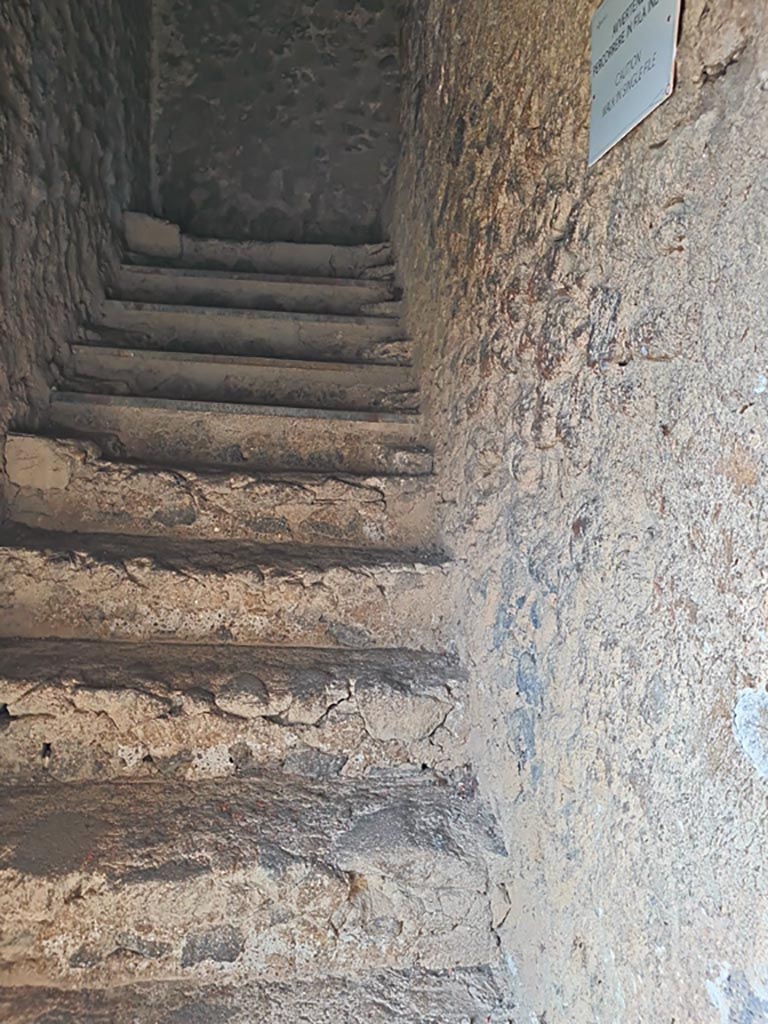 Tower XI, Pompeii. November 2023. 
Looking west up steps from entrance doorway towards middle floor. Photo courtesy of Giuseppe Ciaramella.