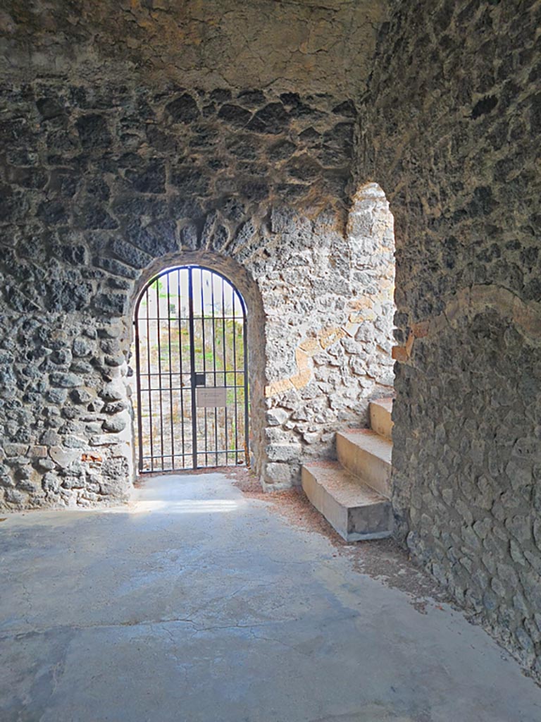 Tower XI, Pompeii. November 2023. 
South-east corner of middle floor room, with doorway leading east onto walls, in centre, and steps to upper floor, on right.
Photo courtesy of Giuseppe Ciaramella.
