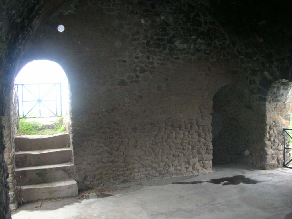 Tower XI, Pompeii. May 2010. South wall of middle floor, with steps and doorway leading up to upper floor, on left.
On right, doorway in west wall leading onto wall/walk. Photo courtesy of Ivo van der Graaff.