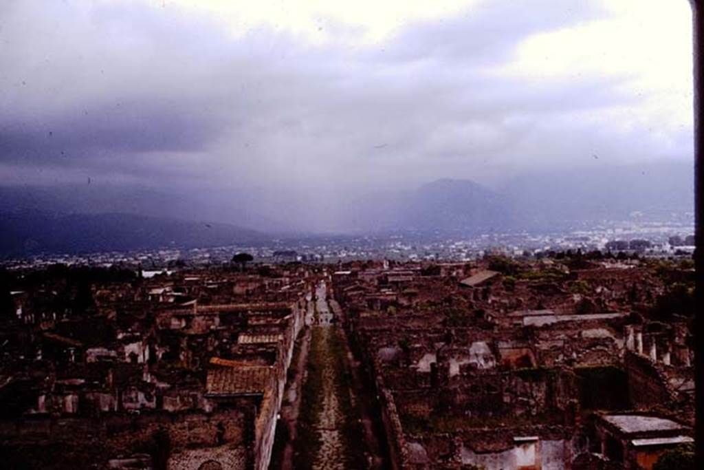Via di Mercurio, Pompeii. 1964. Looking south from Tower XI.  Photo by Stanley A. Jashemski.
Source: The Wilhelmina and Stanley A. Jashemski archive in the University of Maryland Library, Special Collections (See collection page) and made available under the Creative Commons Attribution-Non Commercial License v.4. See Licence and use details.
J64f1008