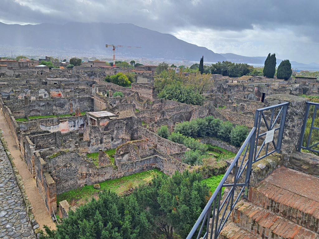 Tower XI, Pompeii. November 2023. 
Looking south-west across VI.7 and VI.5 towards Sorrentine peninsula, from upper floor. Photo courtesy of Giuseppe Ciaramella.