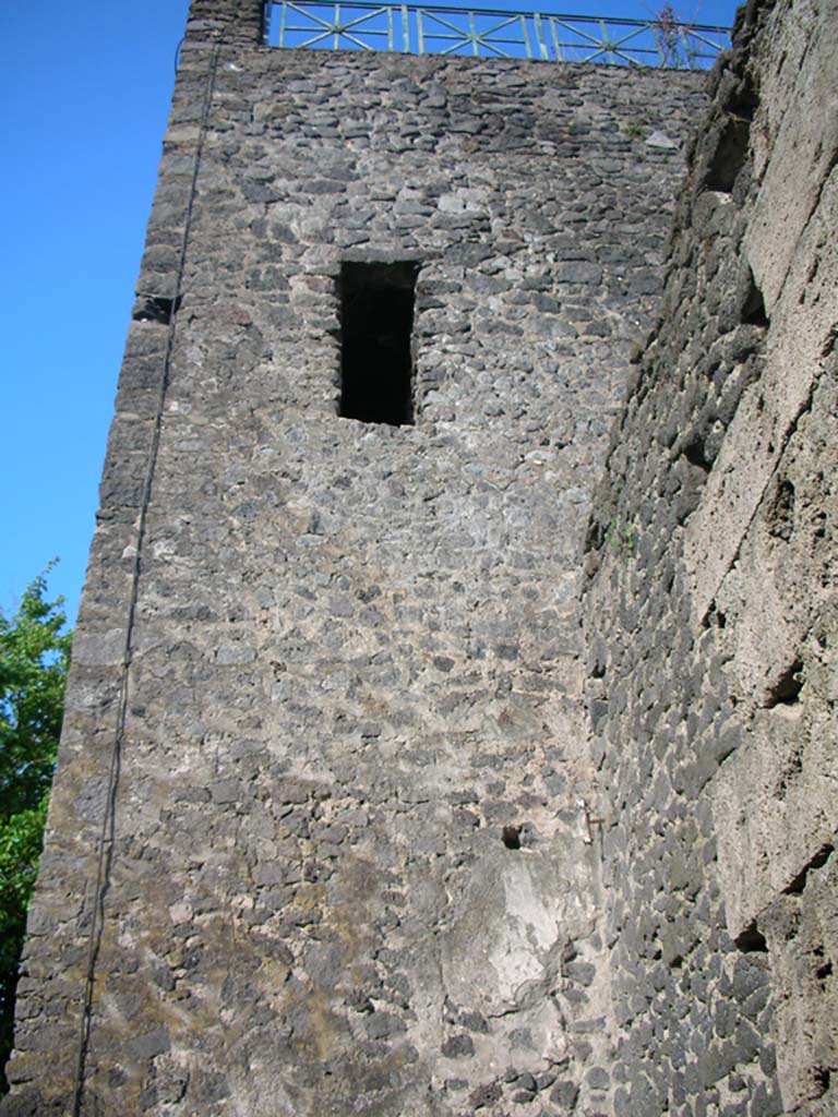 Tower XI, Pompeii. May 2010. 
Looking east along City Wall towards upper west side of Tower. Photo courtesy of Ivo van der Graaff.
