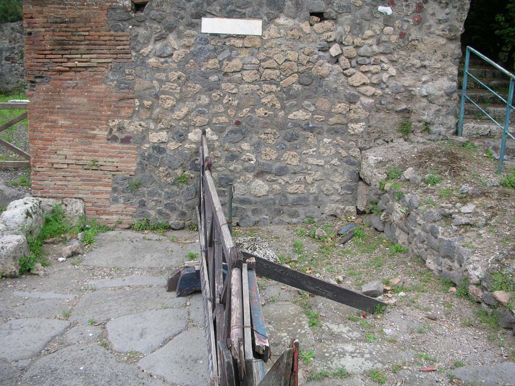 Tower XI, Pompeii. May 2010. 
Looking towards west side of Via di Mercurio, with steps on south-west side of Tower XI. Photo courtesy of Ivo van der Graaff.