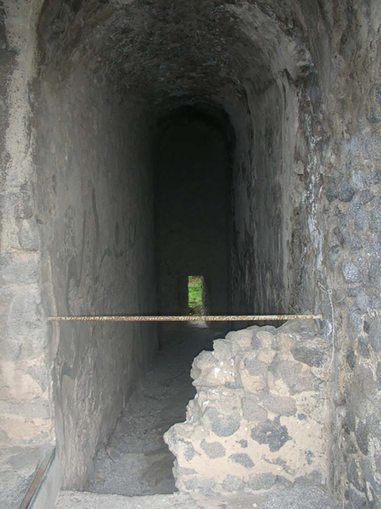 Tower XI, Pompeii. May 2010. Looking north from entrance doorway. Photo courtesy of Ivo van der Graaff.
According to Van der Graaff -
The postern and the stairs heading down to the main chamber of Tower XI was walled up in antiquity in a similar fashion to Tower VIII, but it remains unclear when or why this happened. 
See Van der Graaff, I. (2018). The Fortifications of Pompeii and Ancient Italy. Routledge, (p.135 and Note 104).