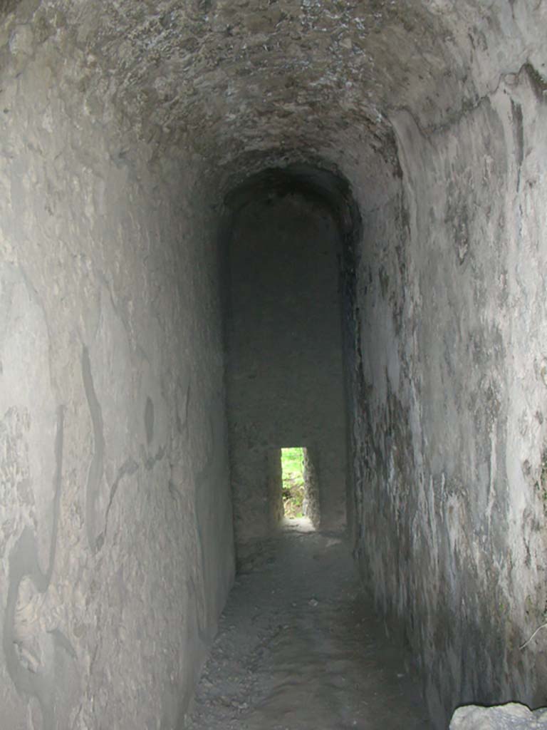 Tower XI, Pompeii. May 2010. 
North wall with arrow slit window in corridor/steps from entrance doorway. Photo courtesy of Ivo van der Graaff.