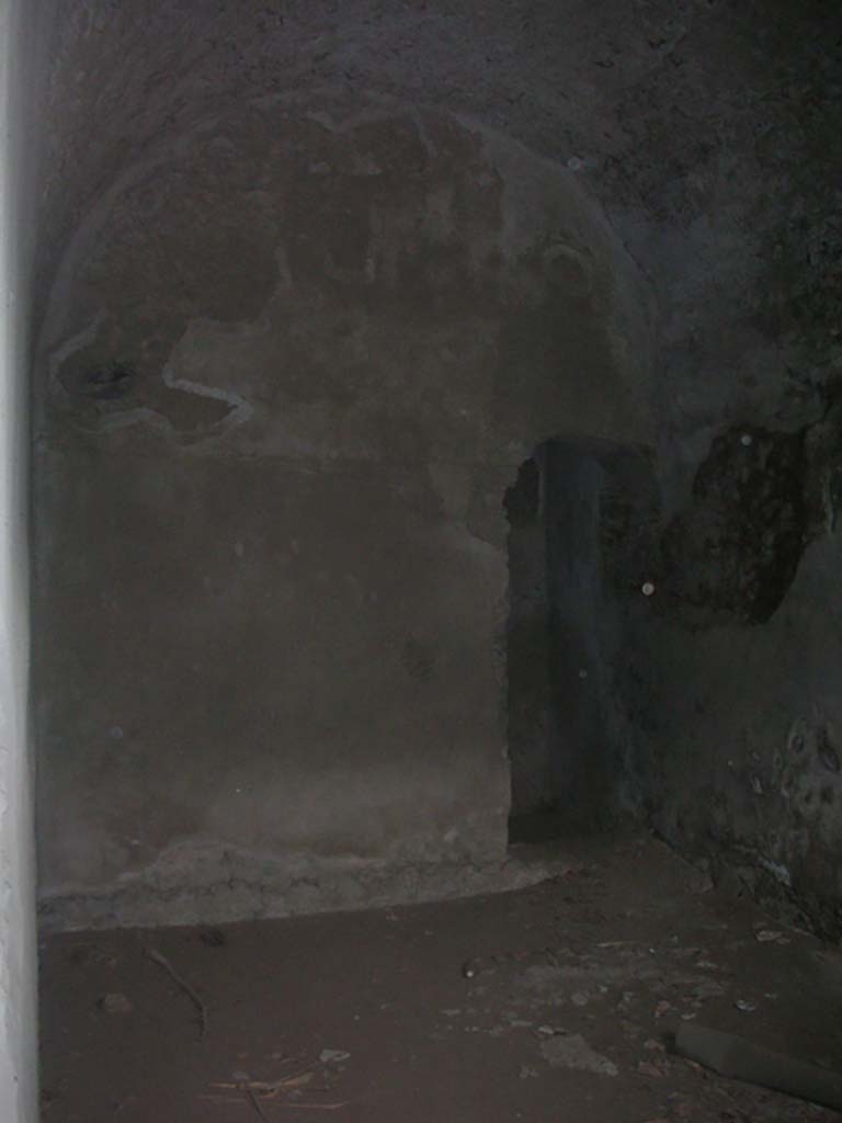 Tower XI, Pompeii. May 2010. 
South-west corner of lower room, and arched doorway. Photo courtesy of Ivo van der Graaff.