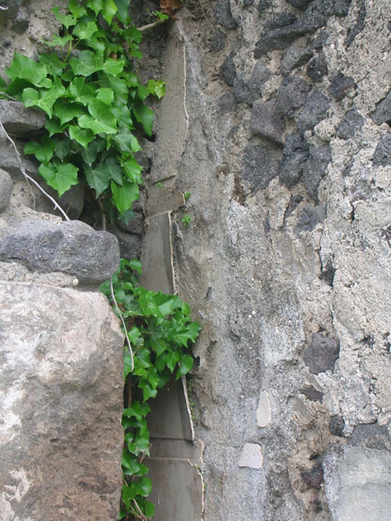 Tower XII, Pompeii. May 2010. 
Detail of remaining plaster on west side of tower. Photo courtesy of Ivo van der Graaff.
