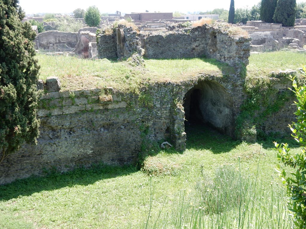 Tower XII looking south-west from walk around walls. May 2015. 
The base of the tower walls can be made out in the grassed area near to the arched room. Photo courtesy of Buzz Ferebee.