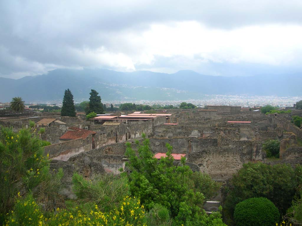 City Walls on north side of Pompeii. May 2010. 
Looking south-east from near Tower XII across VI.7 towards Via di Mercurio and VI.9 from top of wall. Photo courtesy of Ivo van der Graaff.