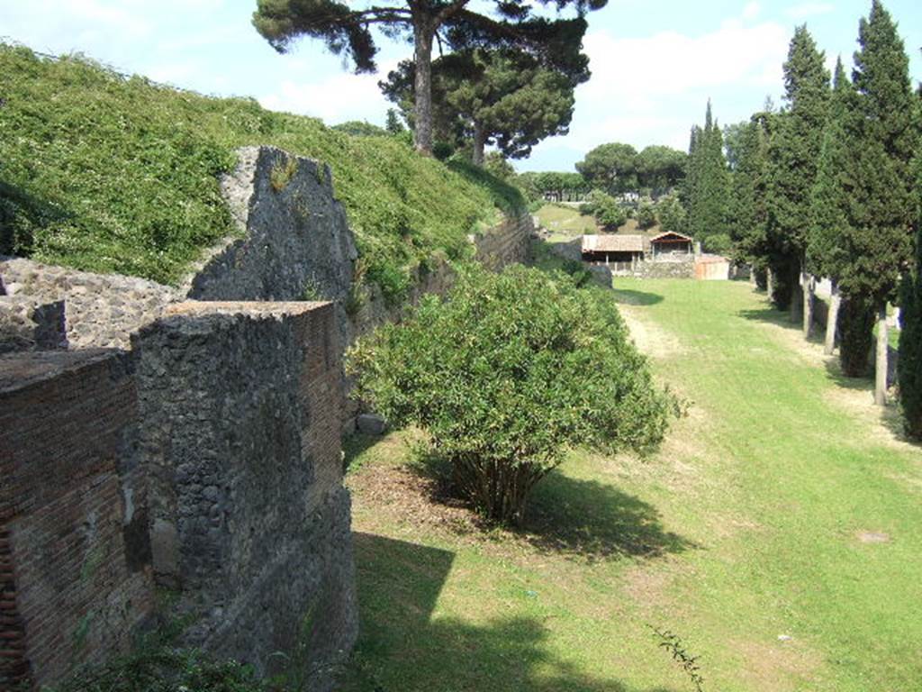 T2 Pompeii. December 2005. Looking east from tower along city walls towards Porta Nocera.