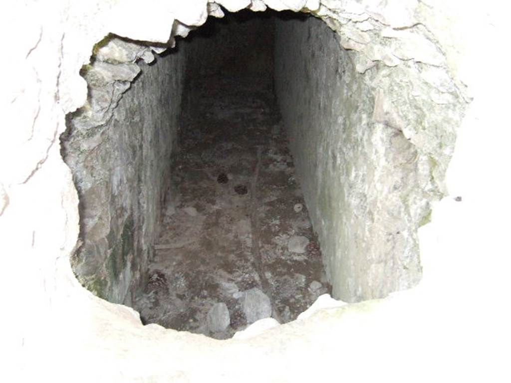 T7 Pompeii. Tower VII. May 2006. Looking south along corridor through arrow slit window on east end of north wall.