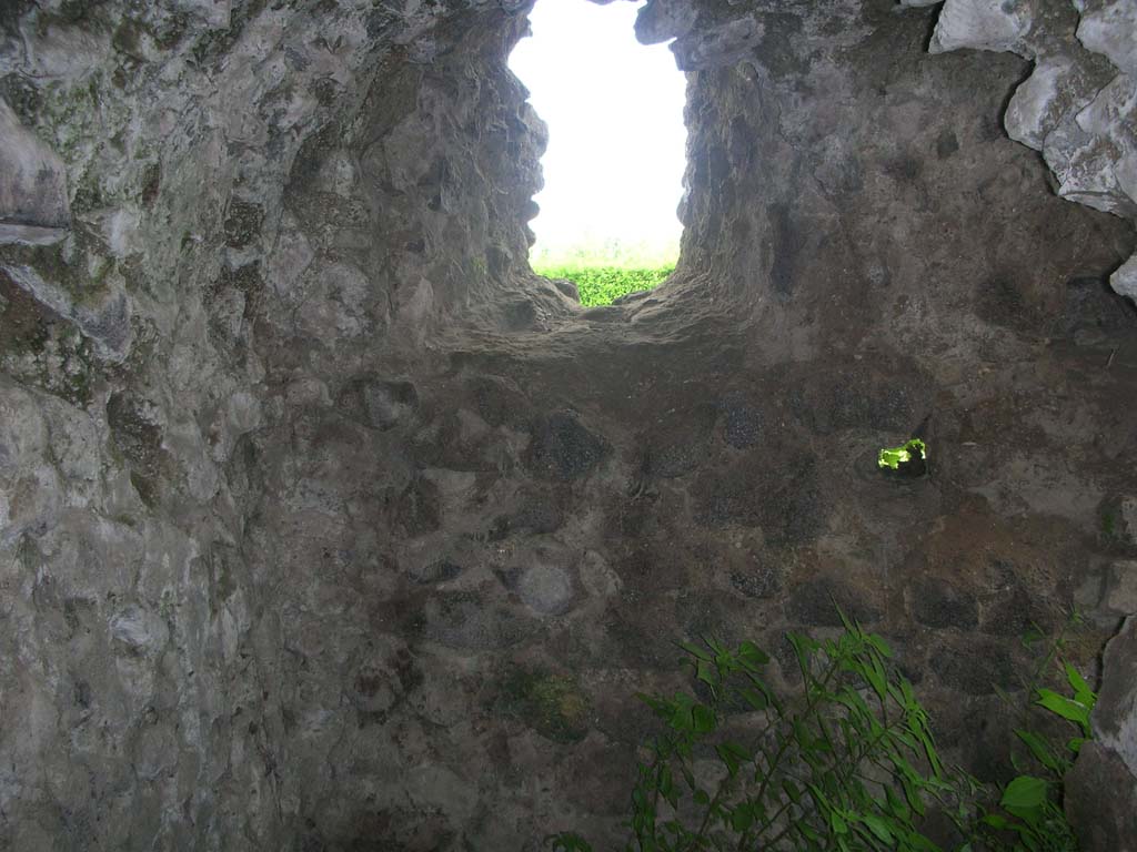 Tower VII, Pompeii. May 2010. 
Looking north through arrow slit window on east end of exterior wall. Photo courtesy of Ivo van der Graaff.