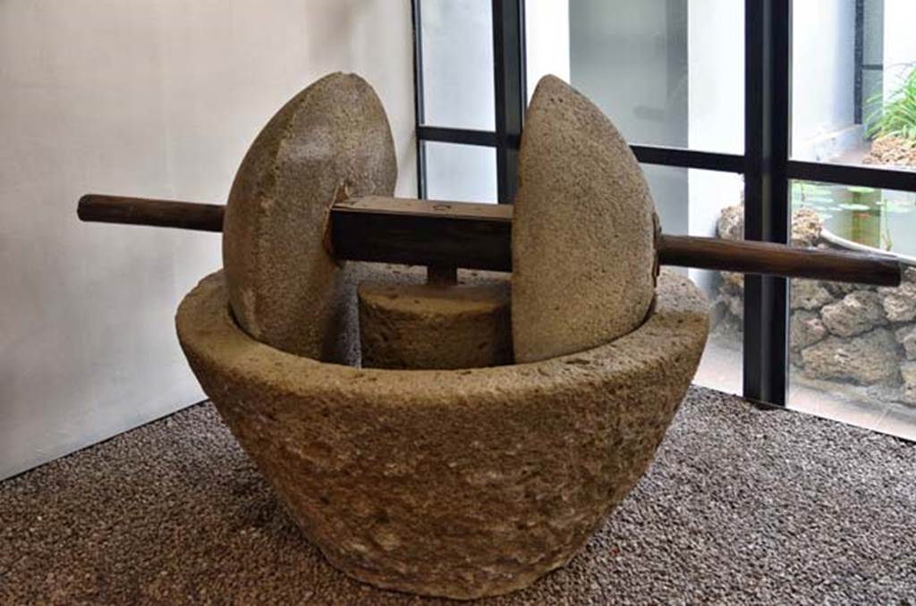 Villa della Pisanella, Boscoreale. April 2018. Oil mill (trapetum) consisting of a frustoconical tub (catillus) and by two wheels of a spherical cap (orbes).
Now in Boscoreale Antiquarium. Photo courtesy of Ian Lycett-King. 
Use is subject to Creative Commons Attribution-NonCommercial License v.4 International.