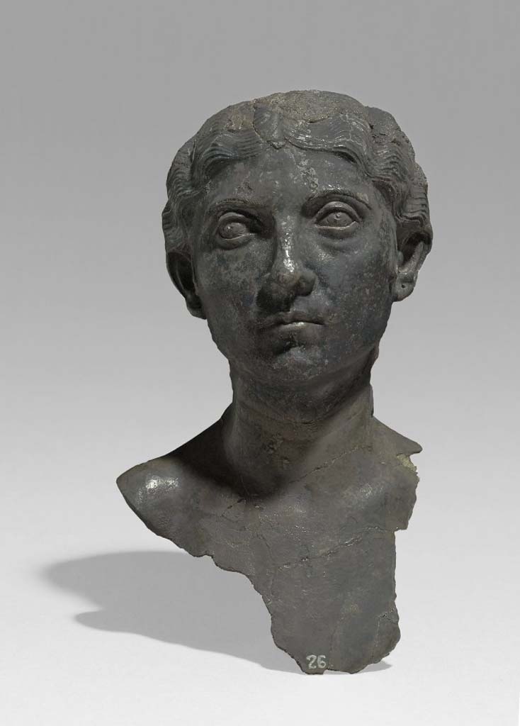 Villa della Pisanella, Boscoreale. The emblema (decorative centre-piece) of a silver dish: bust of a woman, inscribed: "Maxima's". 
The dish was one of a pair, the other representing an elderly man.
According to De Villefosse, this phiale had a pendant of the same shape and the same dimension, decorated with a woman's head. Violently torn, in antiquity, from the washer which formed the bottom of the emblema, as evidenced by the tears in the silver leaf at its base, this head was collected separately in another part of the house and sold before the arrival of the treasure in Paris. After belonging to Count Michel Tyszkiewicz, it entered the collections of the British Museum; the phiale was not found. This female head has exactly the same shape and dimensions as the male head.
L'emblème (pièce centrale décorative) d'un plat d'argent: buste d'une femme, inscrit: "Maxima's".
Le plat était l'un d'une paire, l'autre représentant un homme âgé.
Selon De Villefosse, cette phiale avait un pendant de même forme et de même dimension, orné d'une tête de femme. Violemment arrachée, dans l'antiquité, de la rondelle qui constituait le fond de l'emblema, ainsi que l'attestent les déchirures de la feuille d'argent à sa base, cette tête a été recueillie séparément dans une autre partie de l'habitation et mise dans le commerce avant l'arrivée du trésor à Paris. Après avoir appartenu au comte Michel Tyszkiewicz, elle est entrée dans les collections du Musée britannique; la phiale n'a pas été retrouvée. Cette tête de femme a exactement la même forme et les mêmes dimensions que la tête d'homme.
Voir/See De Villefosse H., 1899. L'argenterie et bijoux d'or du trésor de Boscoreale description des pièces conservées au Musée du Louvre: Monuments et Memories 5 1899 with supplement 1902, p. 45-6, figs. 8-9.
Photo © Trustees of the British Museum. Inventory number BM 1895,0622.1. Use subject to CC BY-NC-SA 4.0.