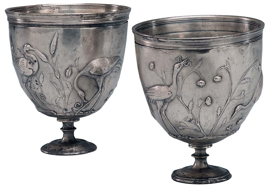 Villa della Pisanella, Boscoreale. Pair of silver cups with cranes in relief.
According to the Morgan Library, each cup consists of an inner liner and an outer casing, which is worked in repoussé. 
The original silver gilt has largely worn away, and the double handles are missing. 
There are guide marks for placing of handles in Greek letters.
The decoration consists of cranes feeding among wheat or sorghum, hunting snakes, a lizard, butterflies, and a grasshopper. 
On one side of one cup, the birds stand beside poppies.
Although the cups were found in Rome, the are believed to be the work of a Greek craftsman.
Probably from the Villa Maxima (=Villa Pisanella) at Boscoreale.
See https://www.themorgan.org/objects/item/161025
Now in The Morgan Library and Museum, New York. Purchased by J.P. Morgan, inventory number AZ050-1 and AZ050-2.