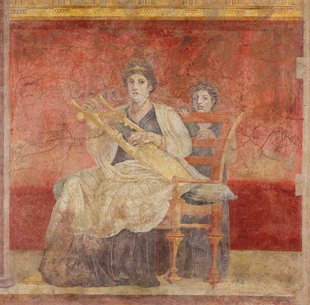 Villa of P Fannius Synistor at Boscoreale. Room H, triclinium or oecus, panel at north end of east wall. 
A seated woman in white and purple garments is playing a golden kithara. 
She and the young girl standing behind her chair looking towards the spectator or the entrance.
Photo © The Metropolitan Museum of Art, Rogers Fund 1903. Inventory number 03.14.5.
See www.metmuseum.org
On the east wall were three paintings.
At the left end was a seated woman wearing purple and white robes, playing a golden lyre. 
At the rear was another female figure, a young girl standing behind the chair.
In the central panel, a couple in conversation on a throne were painted. 
The woman leaning forward with her chin on her fist, gazing at the nude male figure at her side, whose crossed hands rested on a golden staff.
At the right end, was a female painted standing, turning her head upwards to gaze towards the wall with Venus. 
In her right hand, she held a shield which showed the reflection of a nude youth, also gazing towards the north wall and Venus.