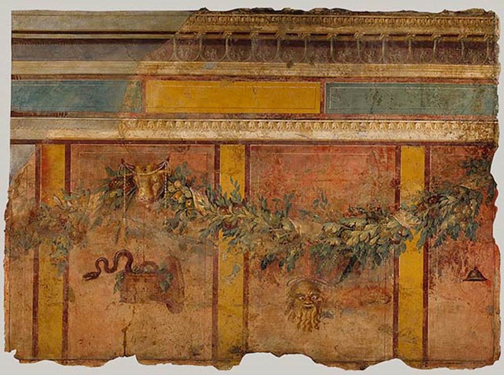 Villa of P Fannius Synistor at Boscoreale. Room L exedra/tablinum, west wall. 
Garland with Silenus mask, sacred basket, and bucrania (ceremonial bulls heads).
These are all references to the god Dionysus.
According to Barnabei, above a dark zoccolo (plinth), a metre tall, finished at the top with a white strip, large red cinnabar panels ran up the wall. 
The panels were one metre and twenty centimetres tall, and eighty centimetres wide. 
These red panels were separated by yellow stripes, about fifteen centimetres wide. 
The red panels were surrounded by a narrow band of brown. 
See Barnabei F., 1901. La villa pompeiana di P. Fannio Sinistore. Roma: Accademia dei Lincei. p. 39-46.
Photo © The Metropolitan Museum of Art, Rogers Fund 1903. Inventory number 03.14.4.
See www.metmuseum.org